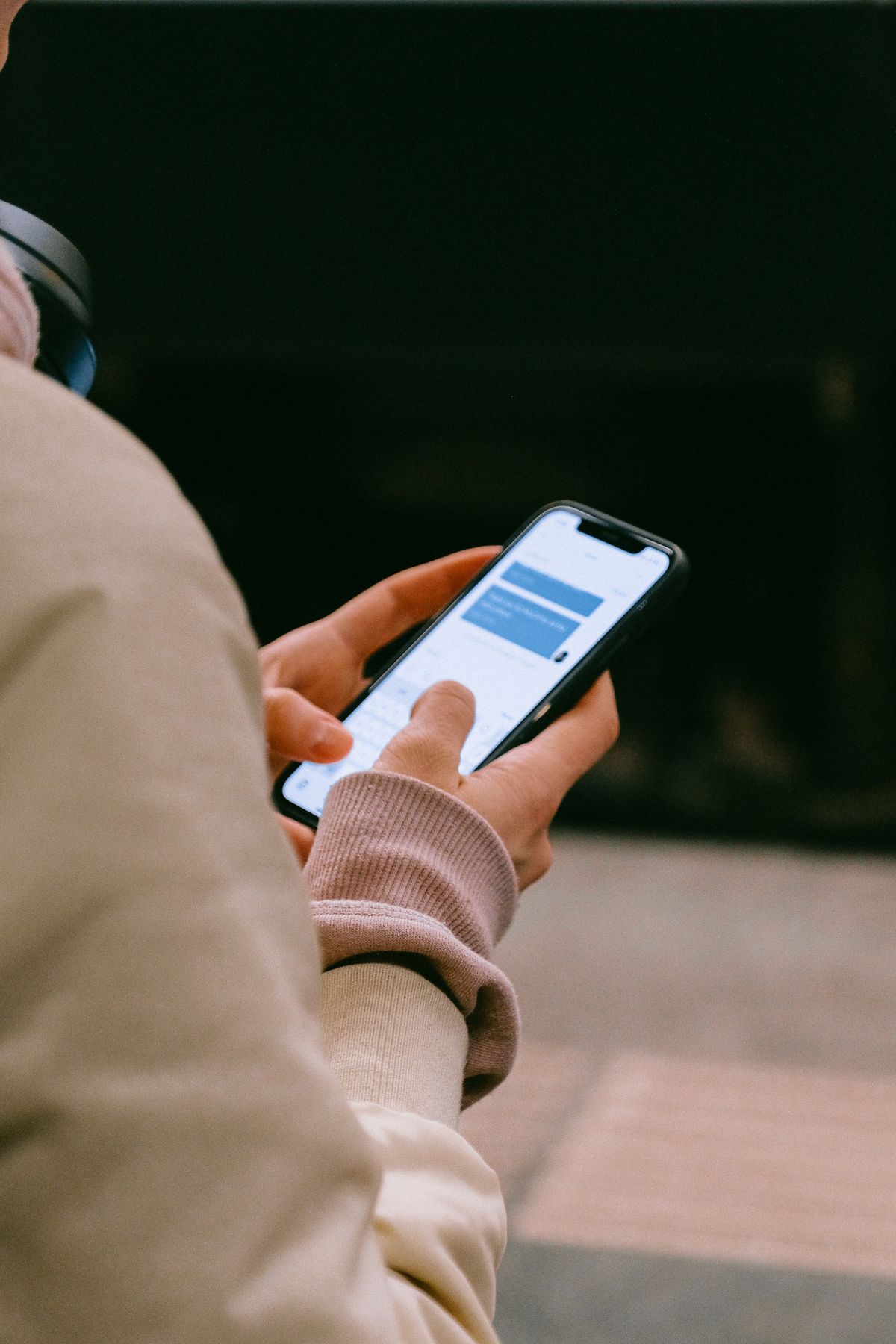 Illustration of hands messaging on a smartphone